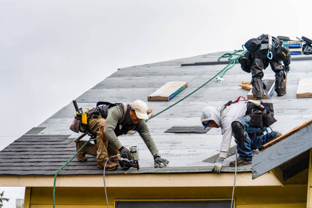 Professional Storm Damage Roof Repair technician working in Fairfax, OK